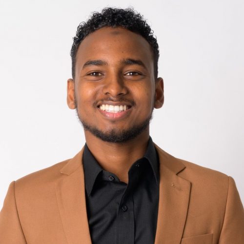 portrait-of-young-happy-african-businessman-smiling-e1629382290236.jpg
